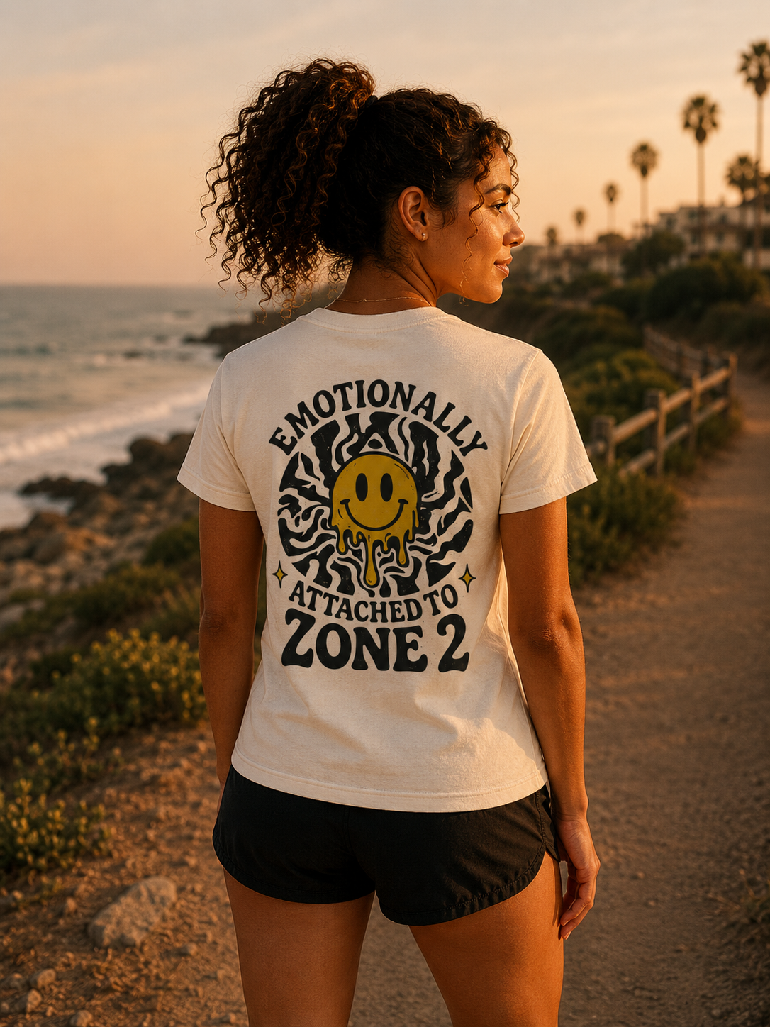 Female runner wearing Easy Miles Emotionally Attached to Zone 2 graphic t-shirt during a run.